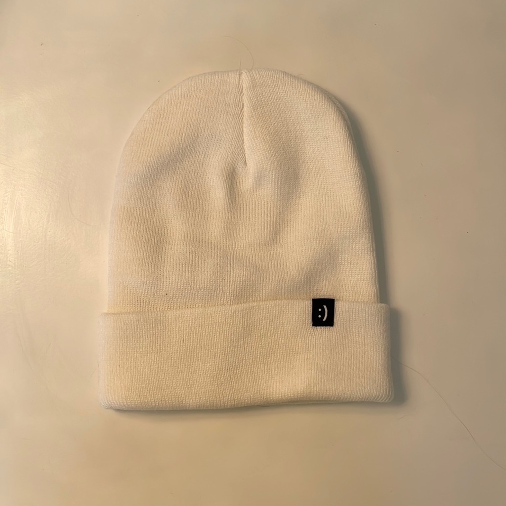 Flip rings brand white beanie with flip smile detail